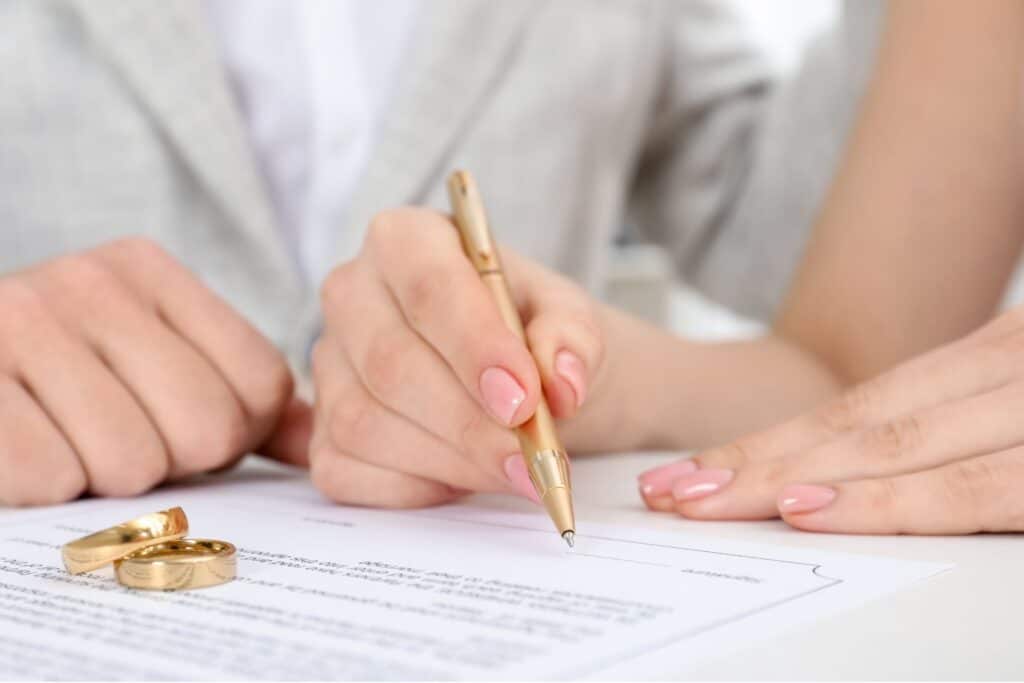 Couple signing prenuptial agreement with attorney - legal requirements and cost considerations