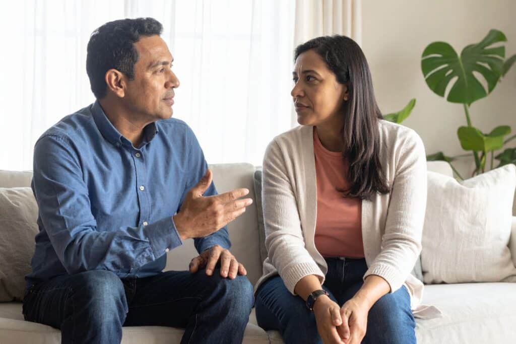 Engaged couple having honest conversation about prenup without conflict - communication tips