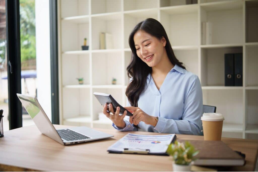 Female business owner reviewing financial documents for prenuptial agreement protection