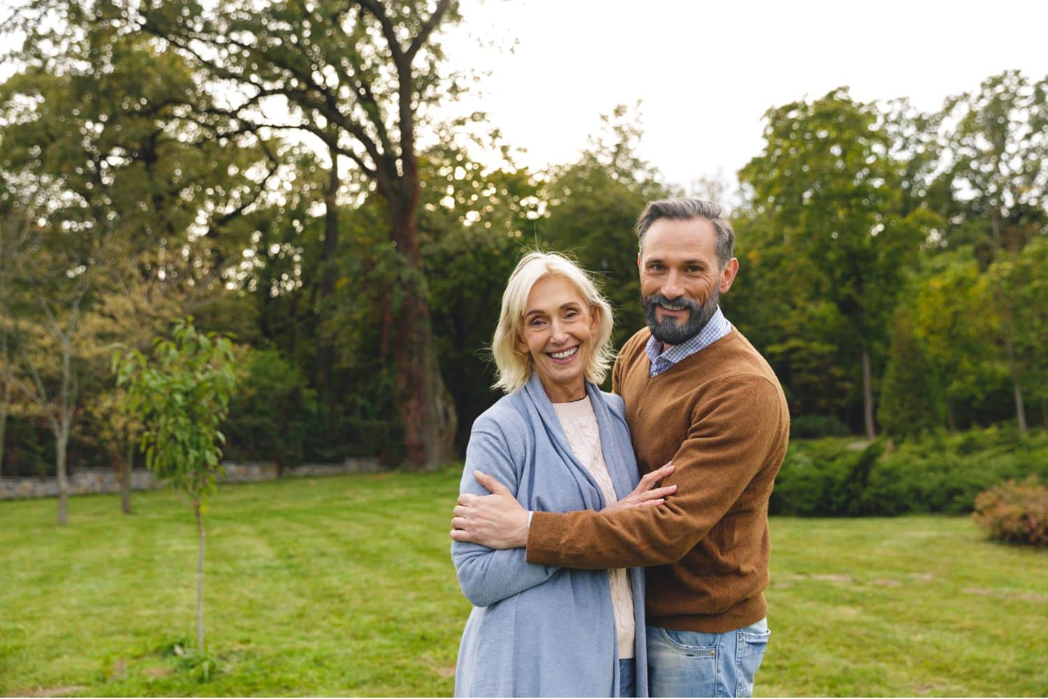 Mature couple reviewing prenuptial agreement documents together for second marriage
